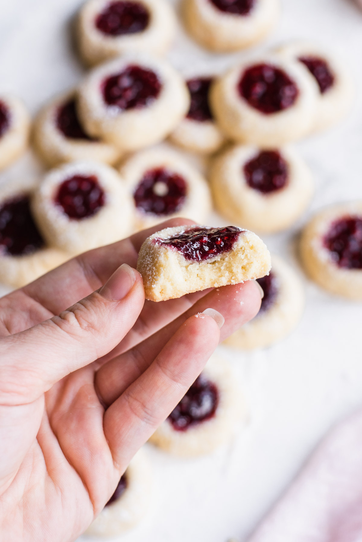 Raspberry Almond Holiday Thumbprint Cookies - GastroSenses